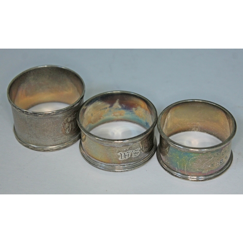 480 - A group of three hallmarked silver serviette rings.