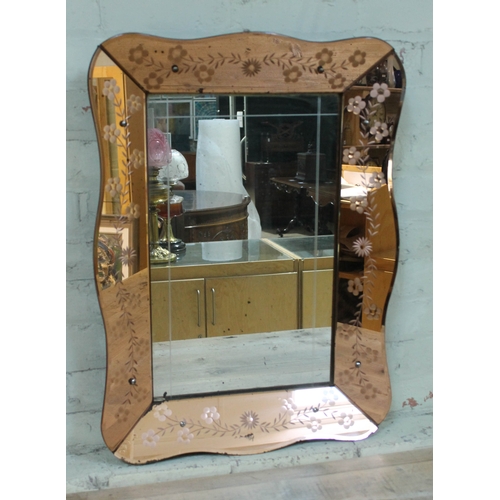 86 - An Art Deco mirror 57cm x 78cm.