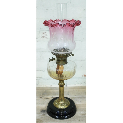 91 - A Victorian brass column oil lamp with cut glass reservoir, pot base and etched glass shade, height ... 