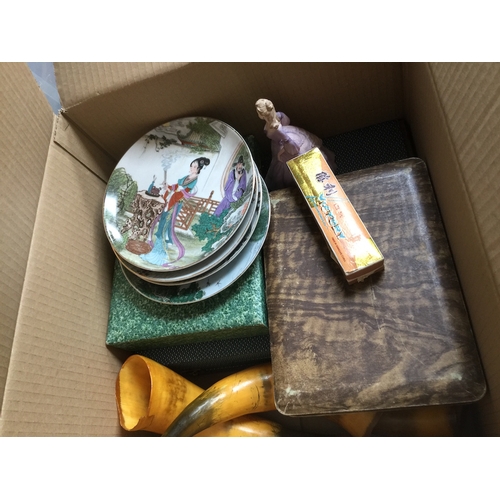 180 - A box of misc cutlery sets, some Oriental plates, 3 animal horns, a harmonica in case, etc