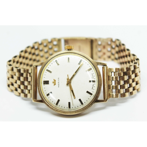 107 - A hallmarked 9ct gold Marvin wrist watch with hallmarked 9ct gold bracelet strap, case diam. 33mm, g... 