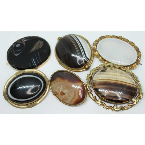 119 - A group of three Victorian yellow metal agate cabochon brooches and three others similar.