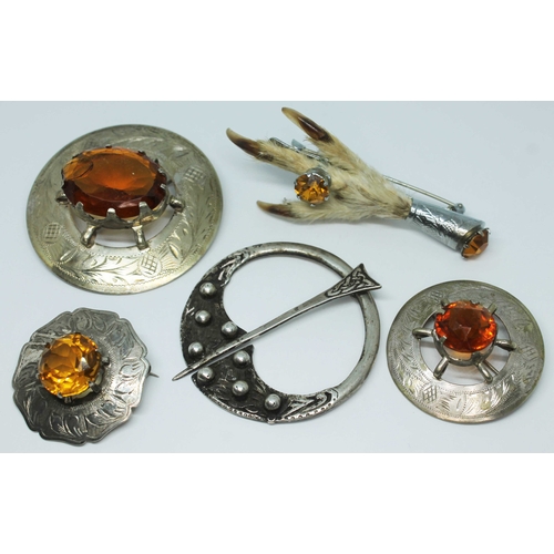 123 - A group of five brooches comprising a Celtic style silver plaid pin, Henderson & Horner Bros, Glasgo... 