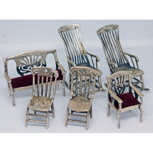 129 - Six miniature silver chairs, each marked '925'.