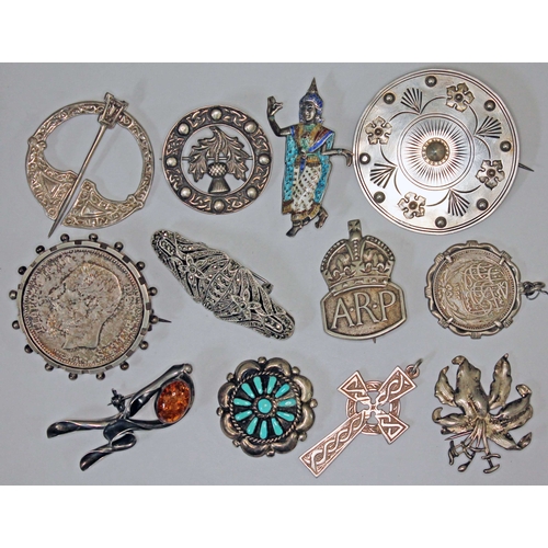 138 - A mixed lot of mainly silver brooches comprising a hallmarked silver Celtic style plaid pin, a hallm... 