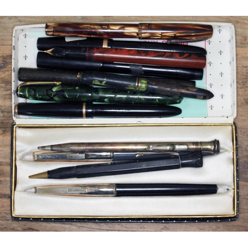 158 - A quantity of vintage pens and pencils comprising eight fountain pens with 14ct gold nibs, a silver ... 