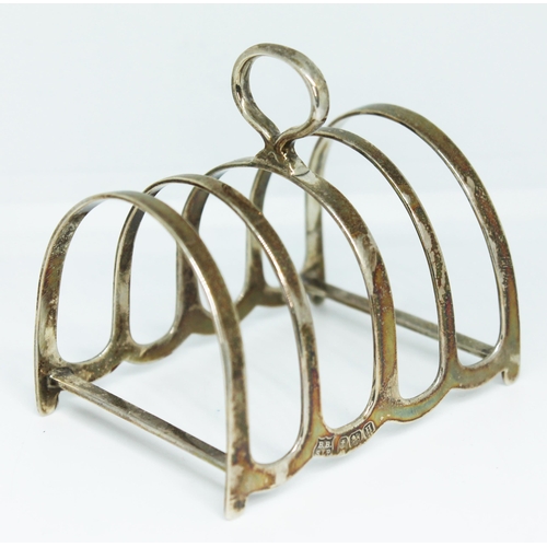 185 - A hallmarked silver toast rack, length 7cm.