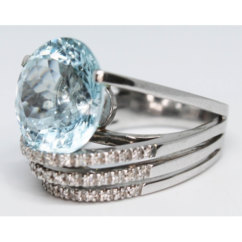 193 - An Italian aquamarine and diamond ring by Marco Zaia (K di Kuore), the round brilliant cut aquamarin... 