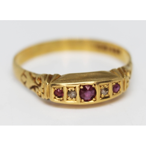 197 - A hallmarked 18ct gold diamond and ruby ring, gross wt.2.4g, size U.