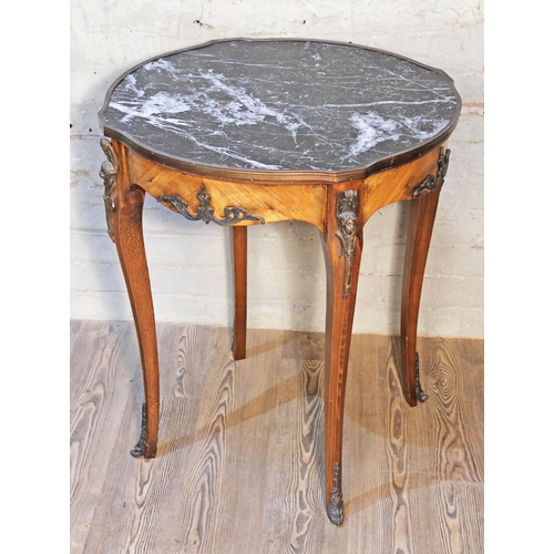 34 - A French occasional table with marble top and gilt metal mounts, diam. 70cm & height 78cm.