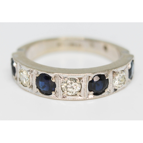 209 - A hallmarked 18ct white gold diamond sapphire white ring, gross wt. 5.9g, size N.