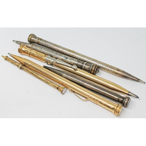 236 - A group of six gold plated and silver plated propelling pencils, 19th century and later.