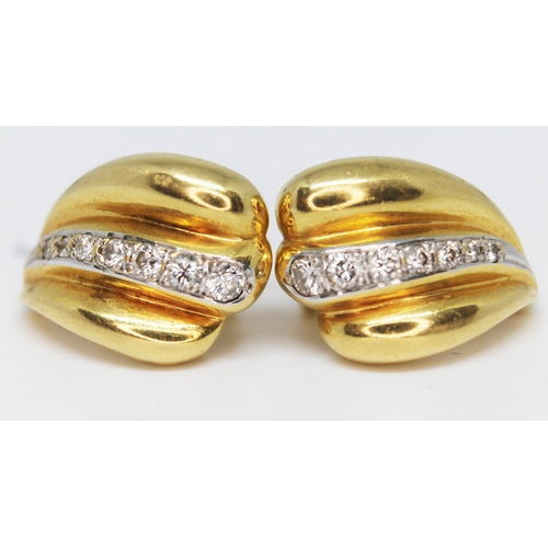 239 - A pair of 18ct gold and diamond set earrings, marked '750', gross wt. 13.8g, length 21mm each.