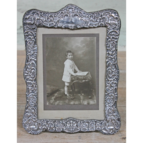 242 - A hallmarked silver photograph frame, height 27cm.