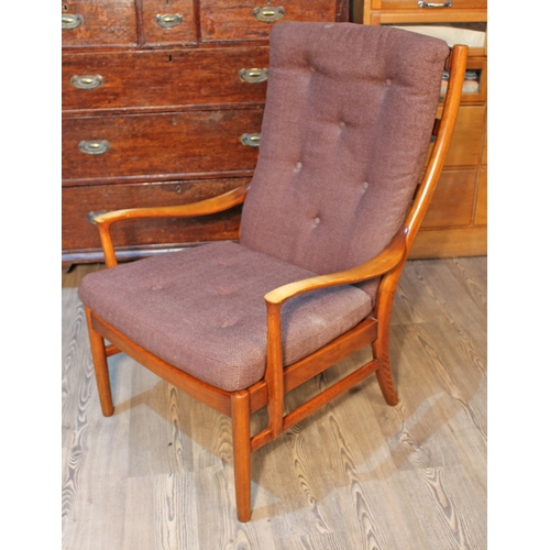 70 - A Parker Knoll armchair, width 65cm, depth 79cm & height 96cm.
(This item may not comply with the Fu... 