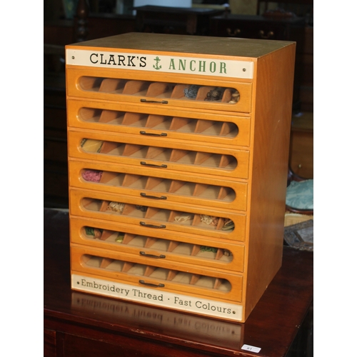 82 - A haberdashery table top cabinet comprising seven glazed drawers with metal handles, perspex label '... 