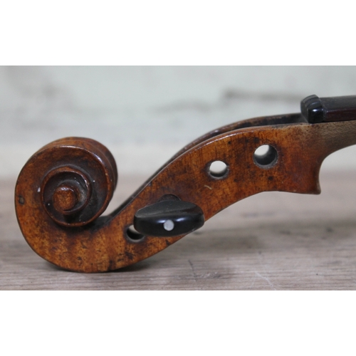 99 - A 19th century violin, unmarked, length of back 37cm.