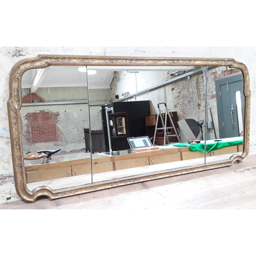 520 - A 19th century mirror, the glass split into three bevelled plates, gilt gesso and wood frame, 130cm ... 