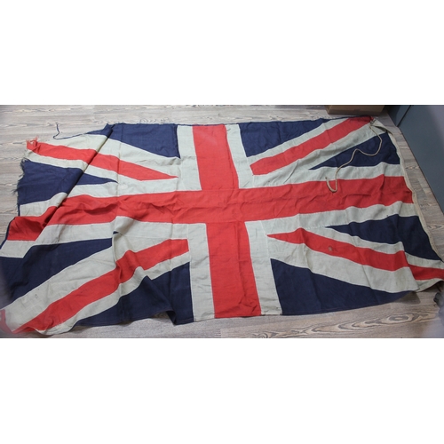 519 - A group of four vintage flags comprising three Union Jacks and one United States, 158cm x 81cm, 269c... 