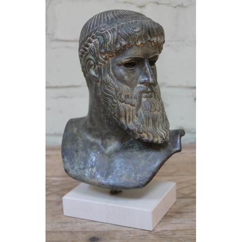 524 - A pottery bust depicting Zeus after the antique with verdi-gris bronze effect finish, suspending abo... 