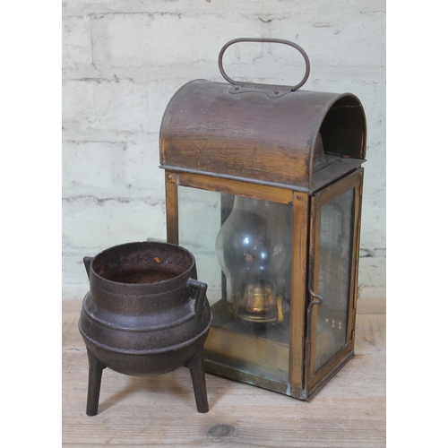 526 - A brass lantern and a cast iron cauldron.