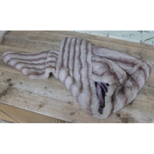 555 - A vintage fur stole in purple and grey colours, measuring 155 cm in length,