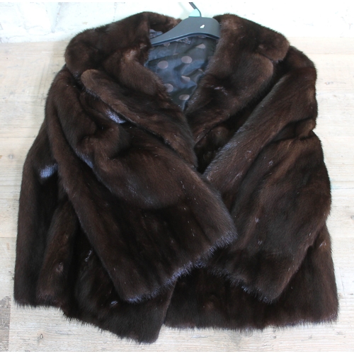 557 - A vintage brown mink fur jacket with double lining and 2 side pockets, size 6 UK.