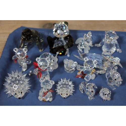 566 - A group of seventeen Swarovski animal ornaments including a panda, gorilla, walrus, monkey, fox, hed... 