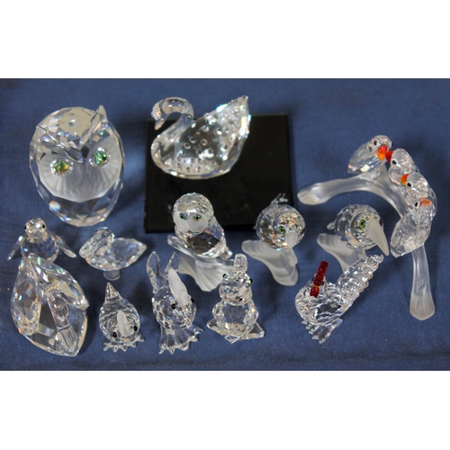 567 - A group of thirteen Swarovski bird ornaments including  owls, swans, chickens etc.