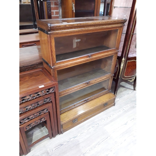 93 - A Globe-Wernicke oak sectional bookcase, width 87cm, depth 37cm & height 104cm.