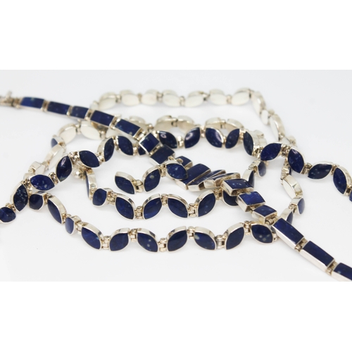 103 - A suite of contemporary silver and lapis lazuli jewellery comprising a necklace and matching bracele... 