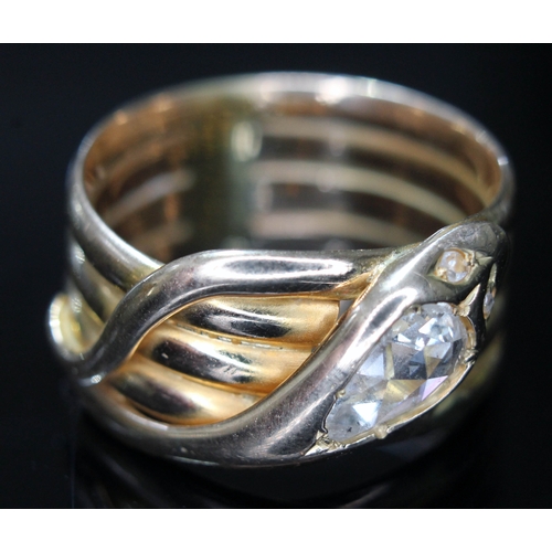 107 - A Victorian 18ct gold ring formed as a coiled snake, the head set with a rose cut pear shaped diamon... 