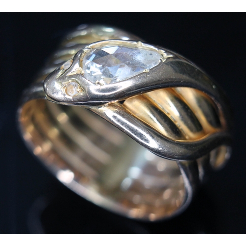 107 - A Victorian 18ct gold ring formed as a coiled snake, the head set with a rose cut pear shaped diamon... 