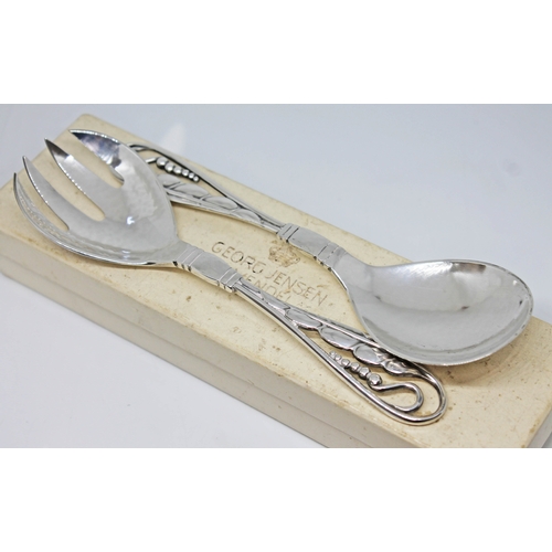 115 - A pair of Georg Jensen Danish silver salad serving spoons circa 1915-1930, hand hammered with leaf a... 