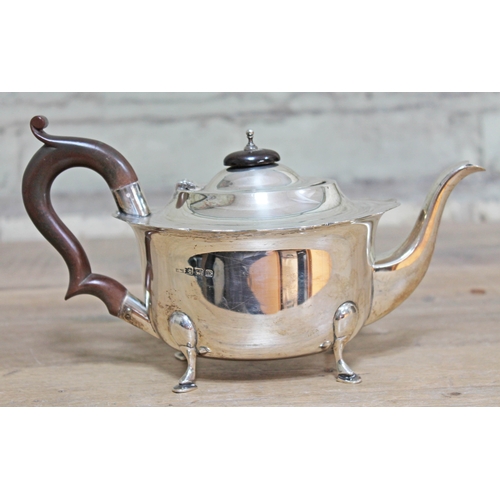 145 - A hallmarked silver teapot, length 24cm, gross wt. 13oz.