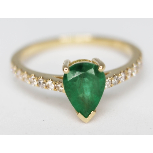 149 - A 14ct gold emerald and diamond ring featuring a natural emerald approx. 0.79ct and diamond set shou... 