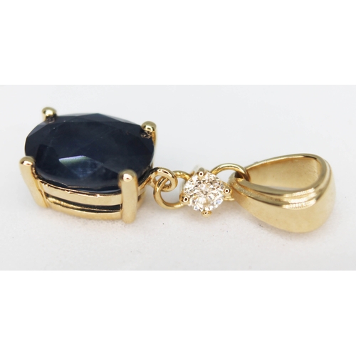 151 - A 14ct gold sapphire and diamond drop pendant featuring a natural medium blue sapphire approx. 1.80c... 