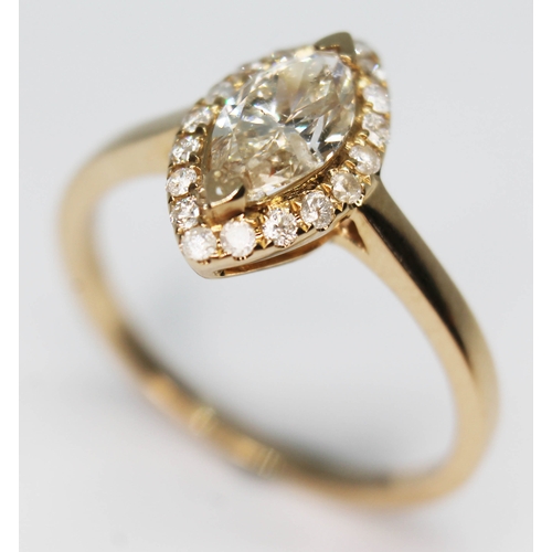 156 - A 14ct gold diamond cluster ring featuring a marquis cut central stone approx. 0.75ct, marked '585',... 