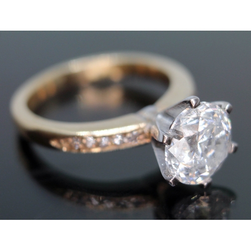 165 - A diamond solitaire ring featuring a round brilliant six claw set stone approx. 2.53ct, diamond set ... 