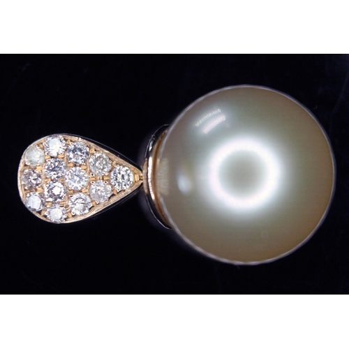 166 - A 14ct gold pearl and diamond pendant, the golden south sea pearl approx. 12mm, featuring thirteen r... 