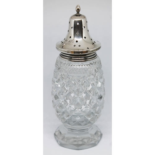 181 - A hallmarked silver top and cut glass sugar castor, height 16.5cm.