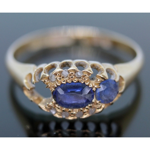 261 - An 18ct gold ring set with blue and colourless stones, gross wt. 2.6g, size O.