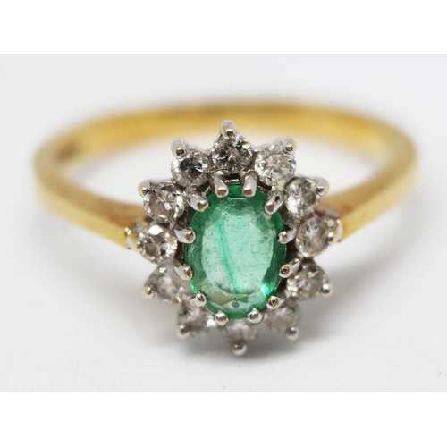 280 - A hallmarked 18ct gold diamond cluster ring set with an emerald coloured stone, gross wt. 4.4g, size... 