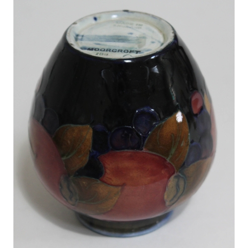 375 - A Moorcroft pomegranate vase, height 10cm.