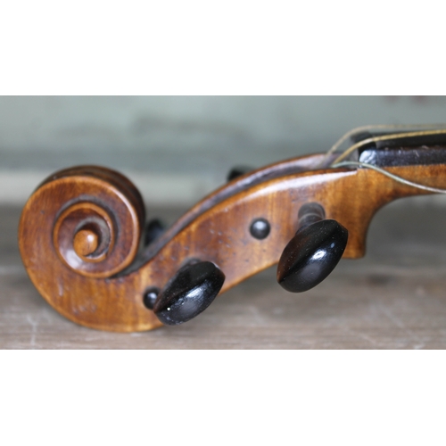 384 - An English violin circa 1900, the back stamped 'Norman Duke' London, length 37.5cm.