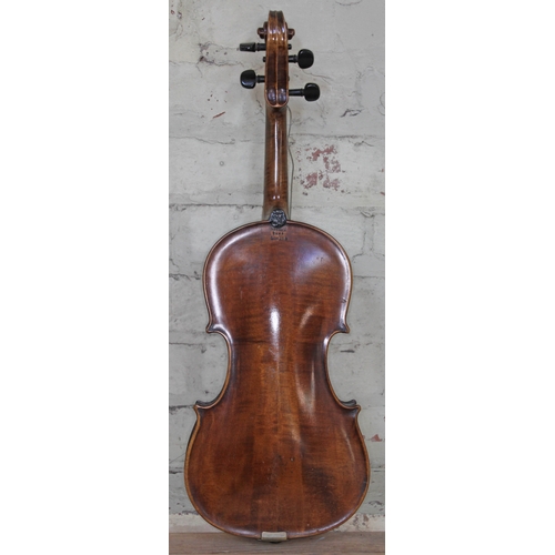 384 - An English violin circa 1900, the back stamped 'Norman Duke' London, length 37.5cm.