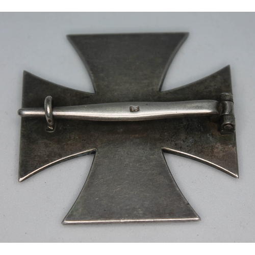 394 - Nazi German WWII Iron Cross First Class, magnetic iron cross with swastika above 1939 in a white met... 