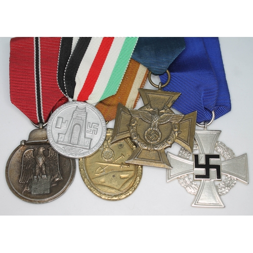 395 - Five Nazi German medals comprising a 25 year service medal, a Border Protection service cross, a Wes... 