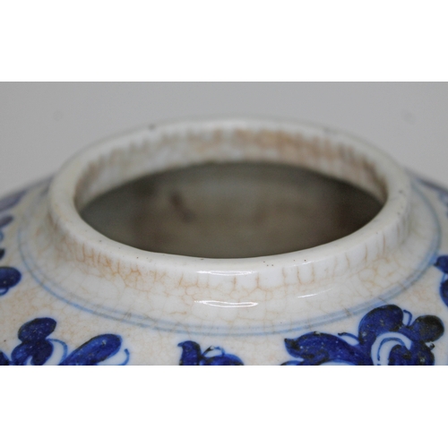 402 - A Chinese porcelain ginger jar and cover of octagonal form and decorated in blue white with lotus fl... 