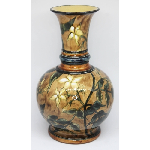 411 - A Doulton Lambeth Faience vase, impressed and painted marks to base and dated 1876, height 16cm.